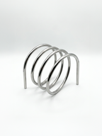 Human Error 001 Book Stand, an industrial heavy-duty steel display for creative professionals.